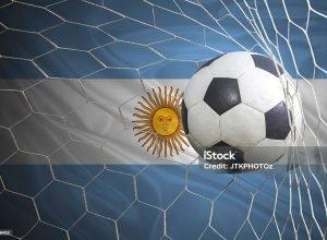 Argentina flag and soccer ball, football in goal net